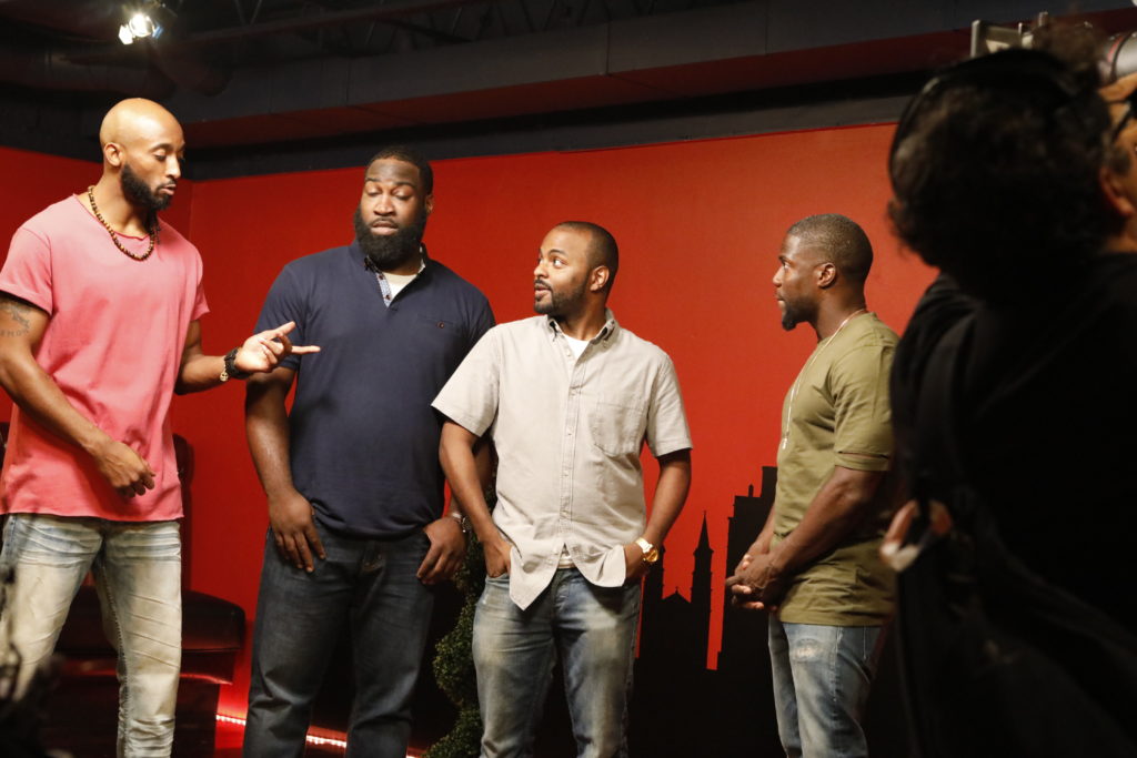Comedians talking on stage at a Baddies Comedy show