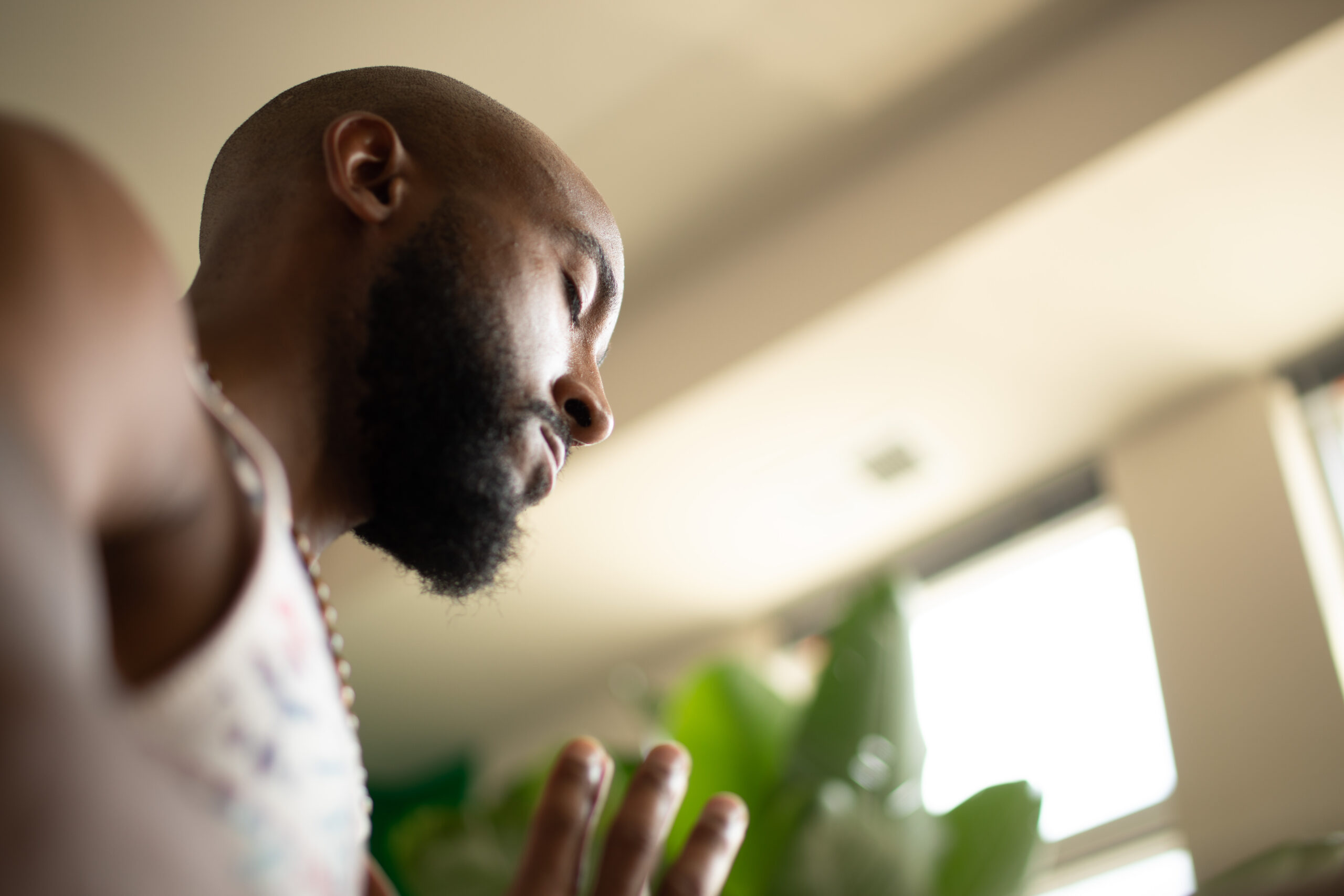Bruce Leroy Williams in a quiet yoga moment by a sunlit window