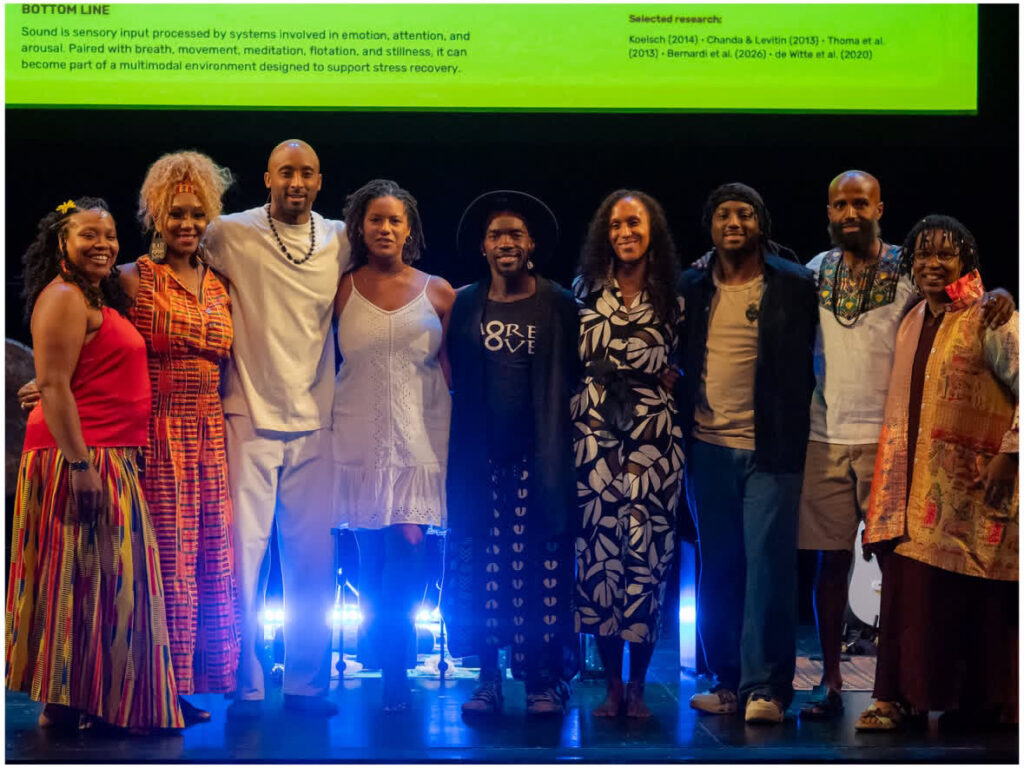 The Floating Soundbath MPLS team on the Guthrie Theater stage at the WeCare Conference