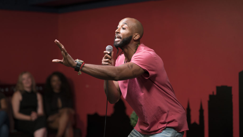 Bruce Leroy Williams performing stand-up comedy on stage