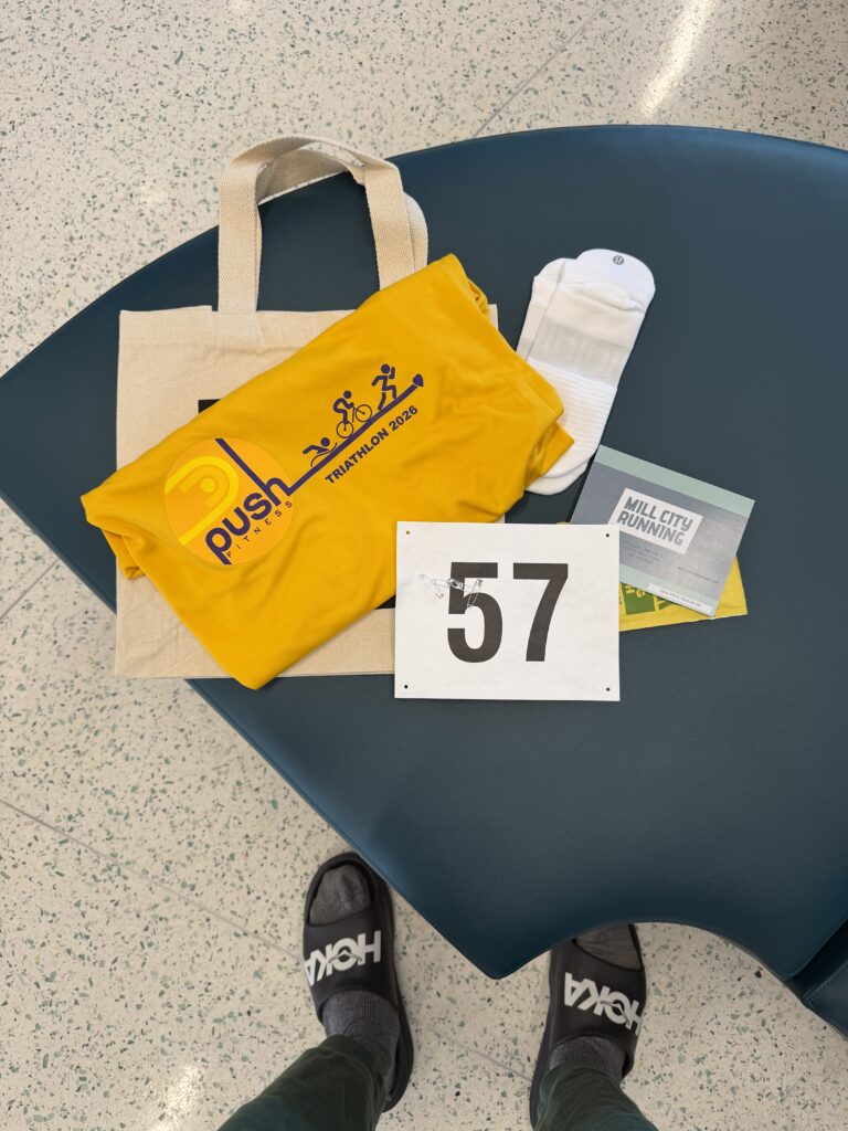 Push Triathlon race packet and bib number 57