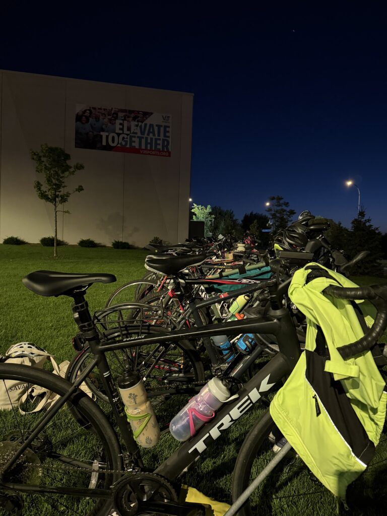 Bikes racked in the transition area before dawn at the Push Triathlon