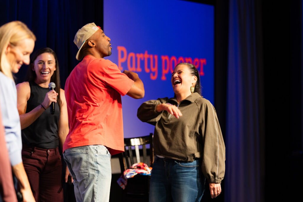 Bruce Brilliance in a comedic side quest on stage at the Twin Cities Game Show